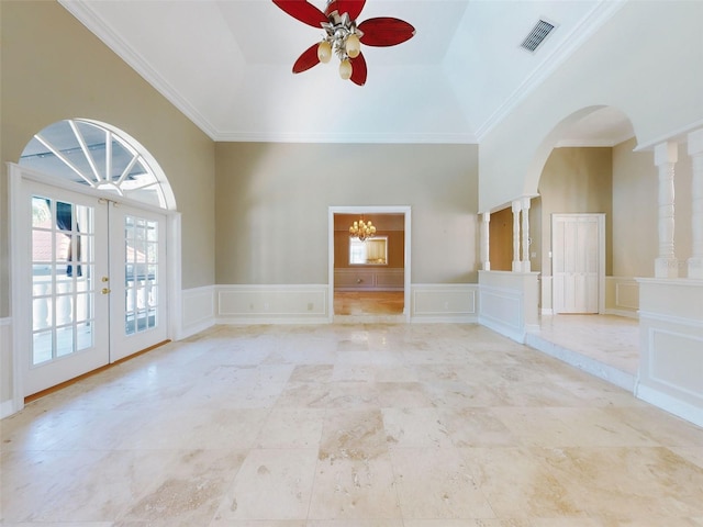 spare room featuring french doors, ceiling fan, ornamental molding, and vaulted ceiling