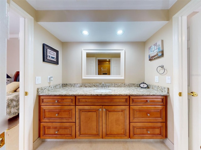 bathroom featuring tile patterned flooring and vanity