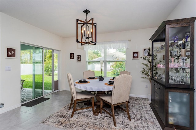 tiled dining space with a notable chandelier