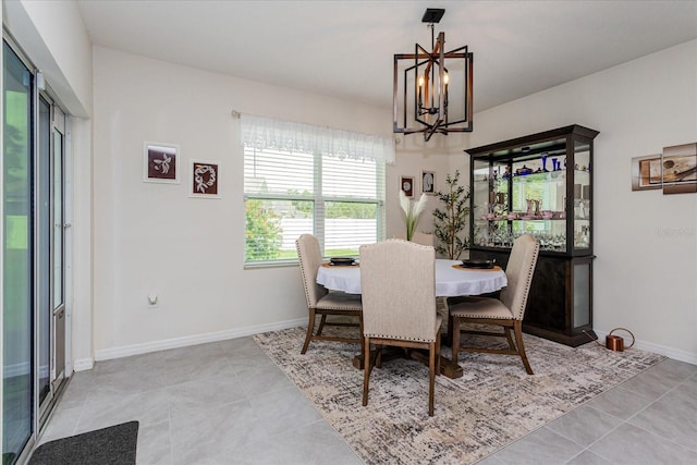 25 Bahia Crse, Ocala, FL 34472 - tiled dining room with a chandelier and baseboards