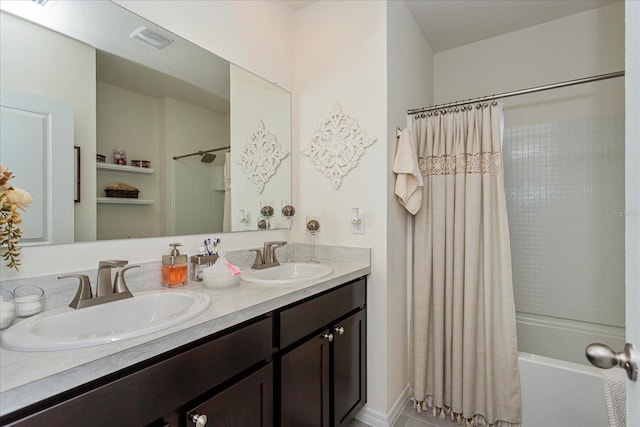 bathroom featuring vanity and shower / bath combo