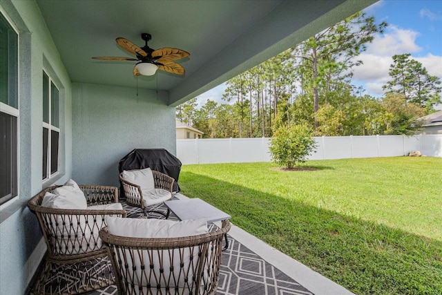 exterior space featuring a grill and ceiling fan