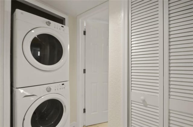 laundry area featuring stacked washer and clothes dryer