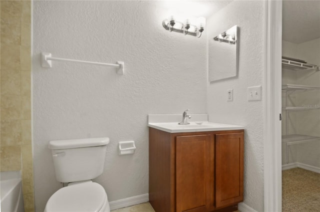 bathroom with toilet and vanity