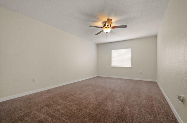 unfurnished room with a textured ceiling, ceiling fan, and carpet floors