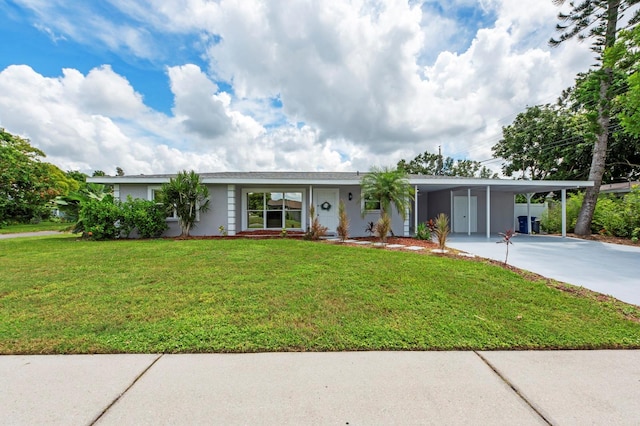 ranch-style house with a front yard and a carport