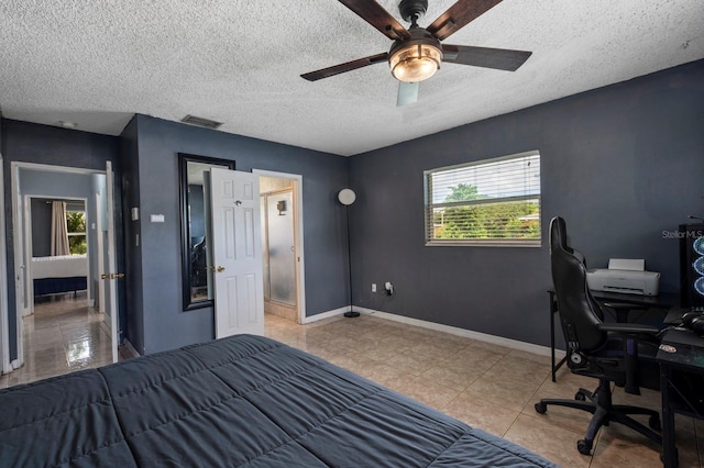 bedroom featuring a textured ceiling and ceiling fan