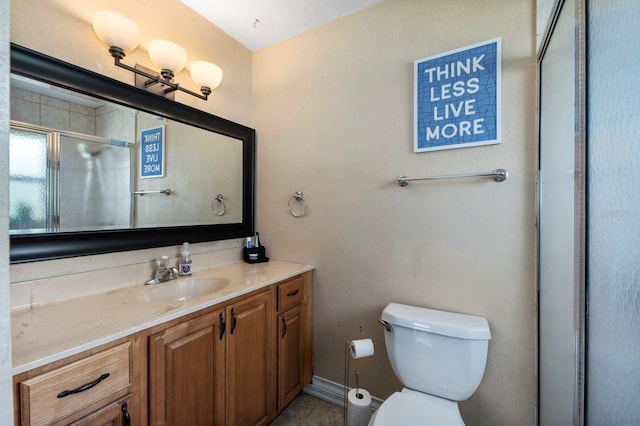 bathroom with walk in shower, toilet, and vanity