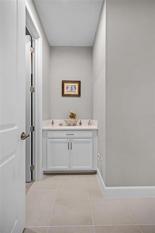 bathroom with vanity and tile patterned floors