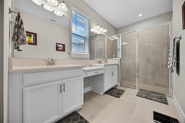 bathroom featuring vanity, an enclosed shower, and tile patterned flooring