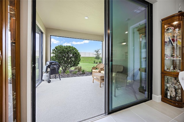 entryway with light tile patterned floors