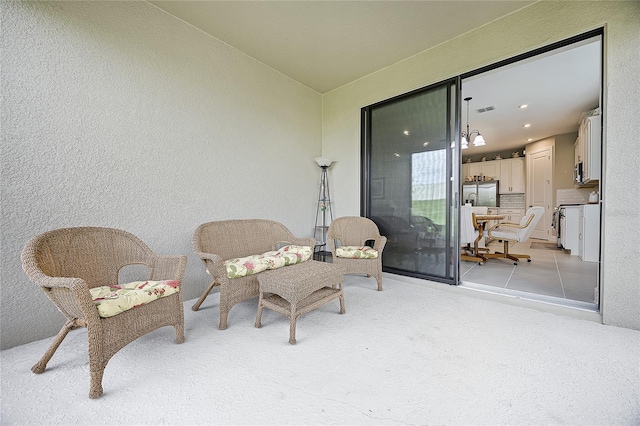 sitting room with light tile patterned floors