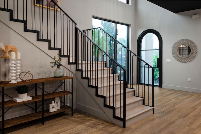 stairs with wood-type flooring