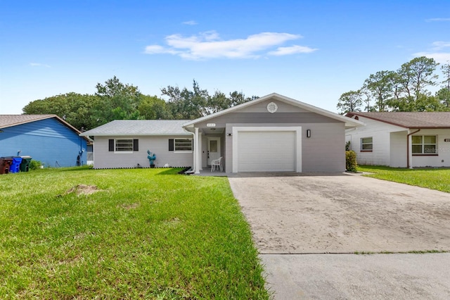 ranch-style home featuring a front lawn and a garage