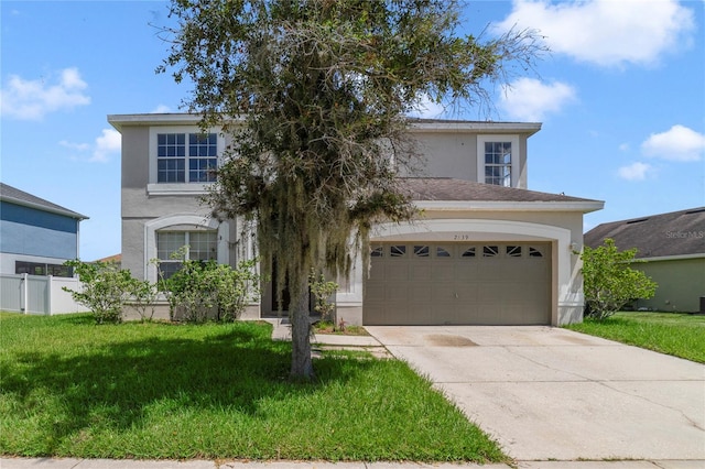 view of front of property with a garage and a front lawn