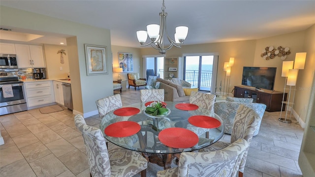 dining space with an inviting chandelier