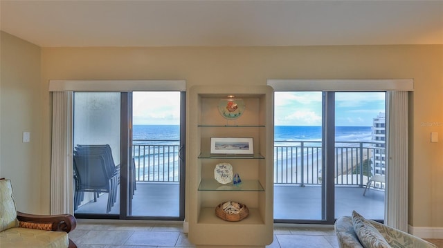 doorway to outside featuring a water view and plenty of natural light