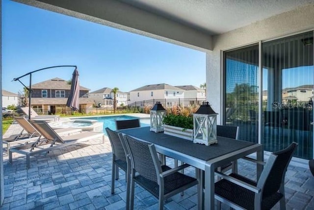 view of patio / terrace featuring a fenced in pool