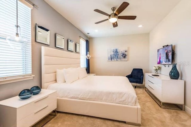 carpeted bedroom with ceiling fan