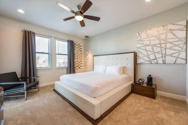 carpeted bedroom with ceiling fan