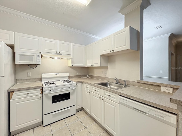 kitchen featuring crown molding, white appliances, light tile patterned flooring, sink, and white cabinets