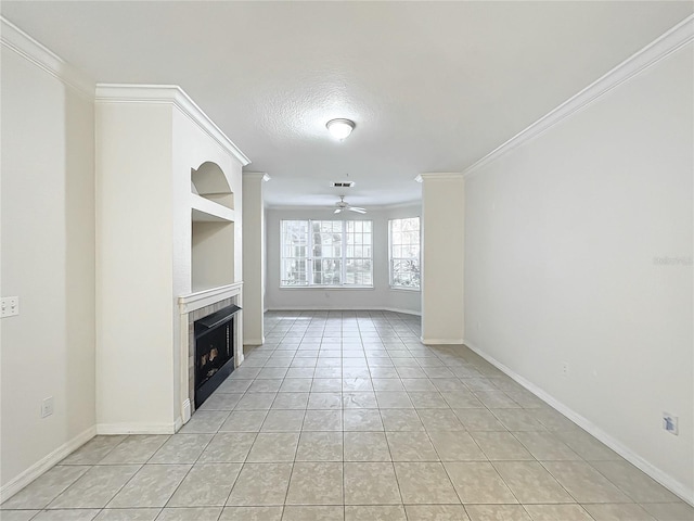 unfurnished living room featuring ceiling fan, a tile fireplace, light tile patterned flooring, and ornamental molding