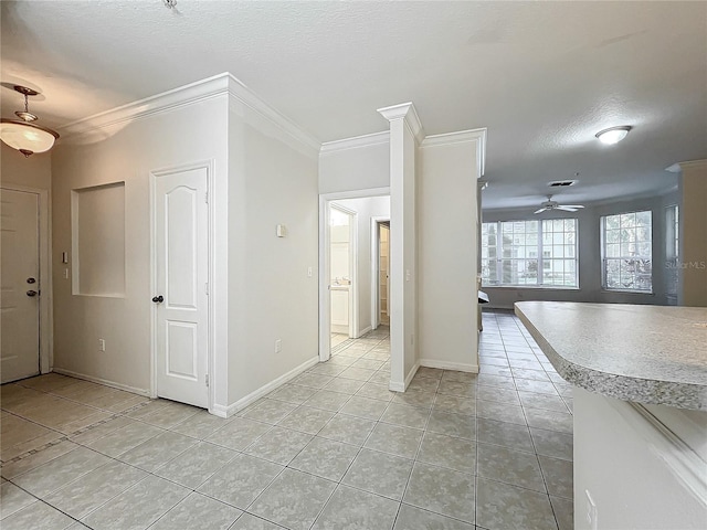 interior space featuring a textured ceiling, crown molding, ceiling fan, and light tile patterned floors