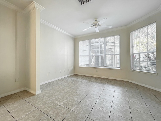 tiled spare room with crown molding and ceiling fan