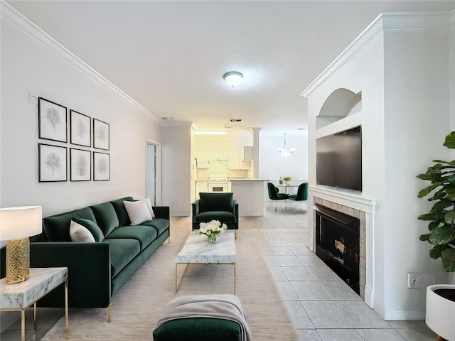 living room with a tiled fireplace, light tile patterned flooring, and ornamental molding