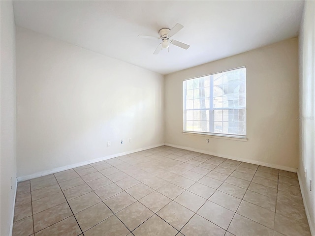 unfurnished room featuring ceiling fan and light tile patterned floors