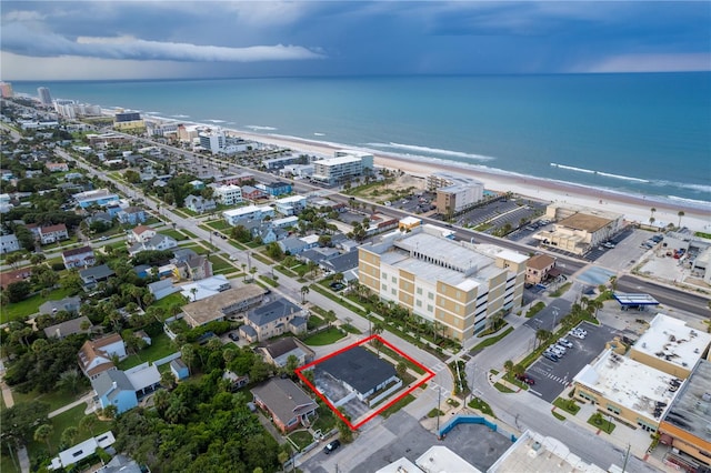 aerial view with a beach view and a water view