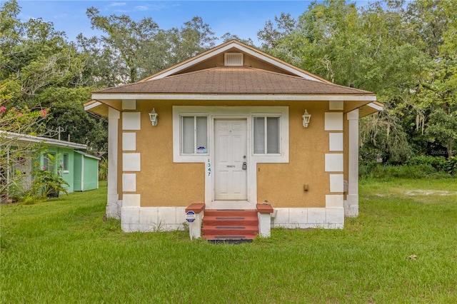 exterior space featuring a front yard