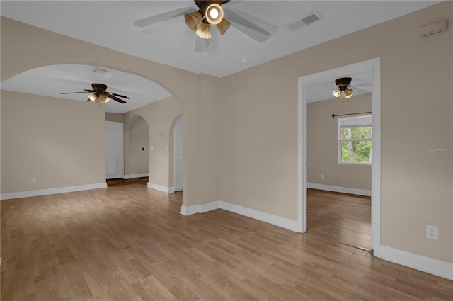 spare room featuring light wood-type flooring and ceiling fan