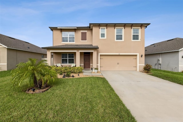 view of front of property featuring a garage and a front yard