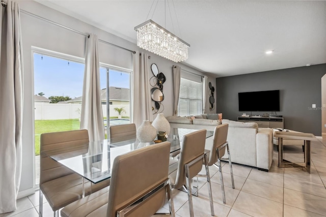 tiled dining area with a notable chandelier