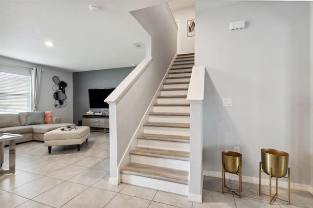 stairway with tile patterned flooring