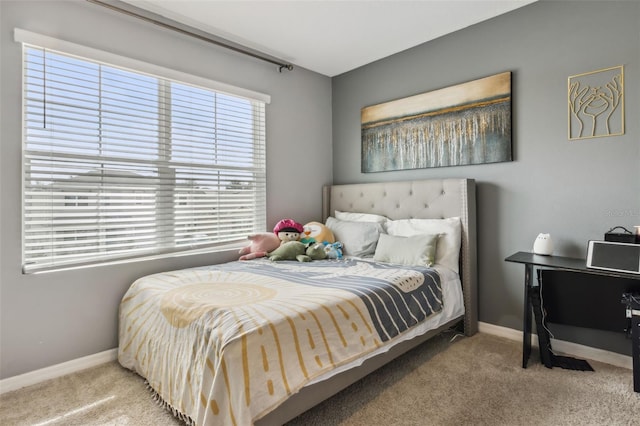 bedroom featuring light colored carpet