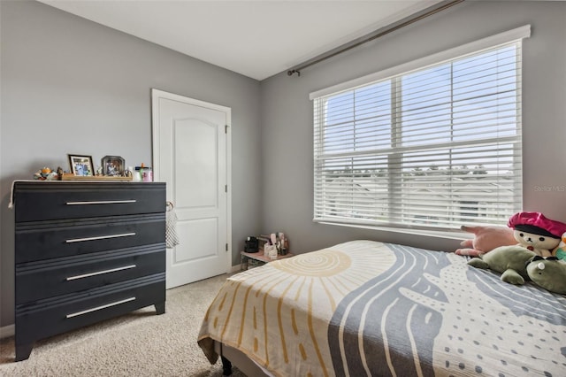 bedroom featuring light carpet