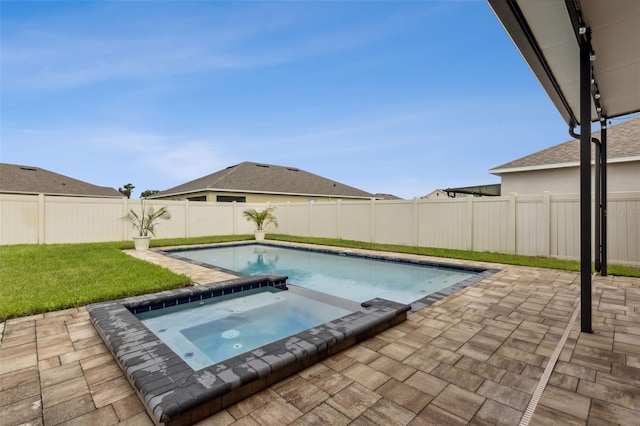 view of swimming pool featuring a patio area and an in ground hot tub