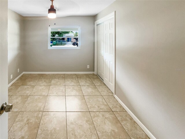 spare room featuring light tile patterned floors