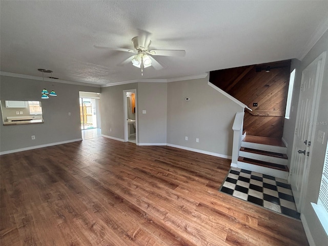 unfurnished living room featuring crown molding, ceiling fan, and wood-type flooring