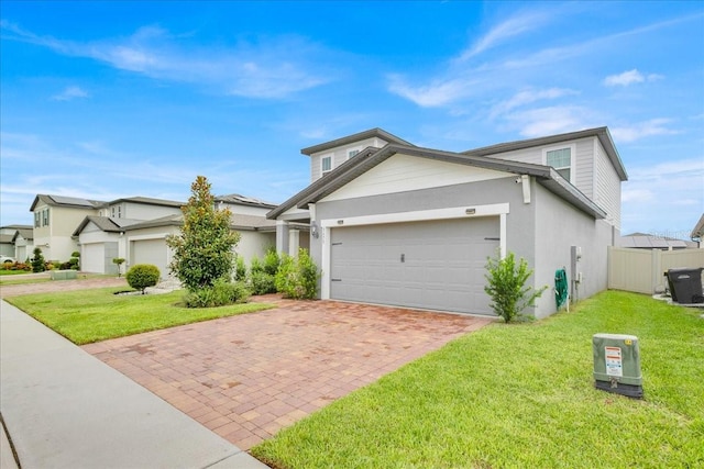 view of front facade featuring a front yard and a garage