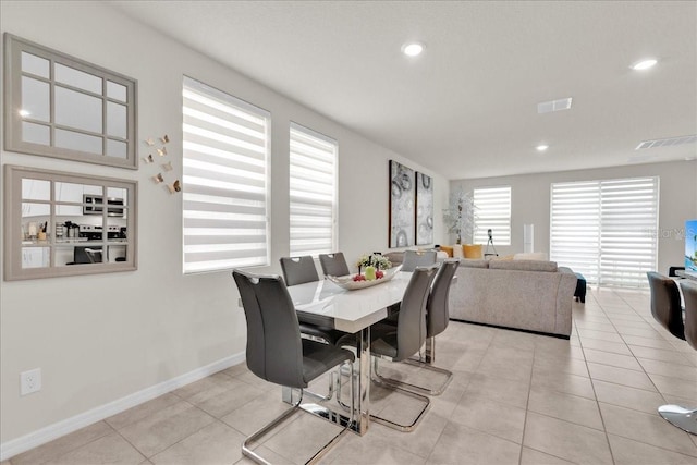 dining space with light tile patterned floors