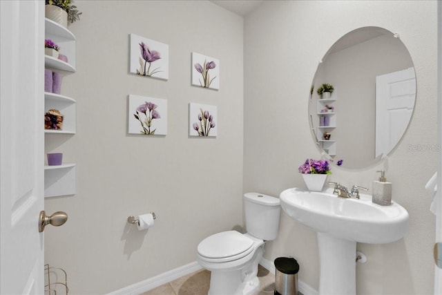 bathroom featuring toilet and tile patterned floors