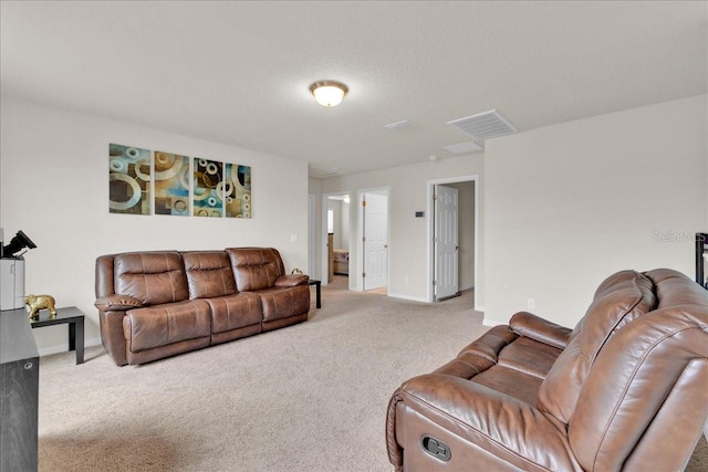 living room featuring light carpet and a textured ceiling