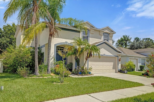 view of front facade featuring a front yard and a garage