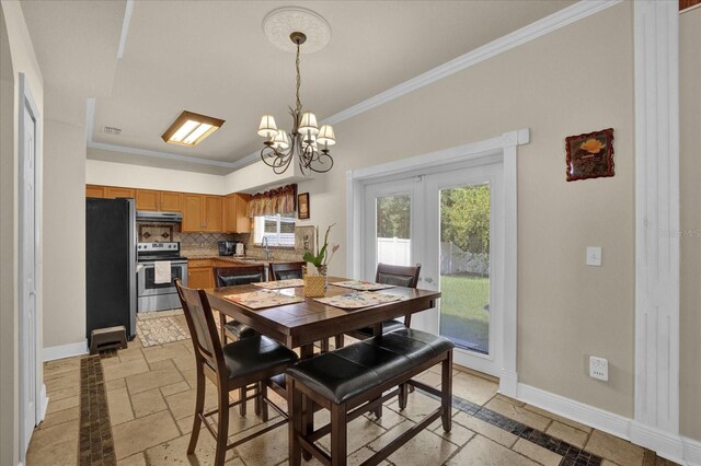 dining room featuring an inviting chandelier and ornamental molding