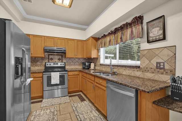 kitchen featuring dark stone counters, crown molding, tasteful backsplash, stainless steel appliances, and sink