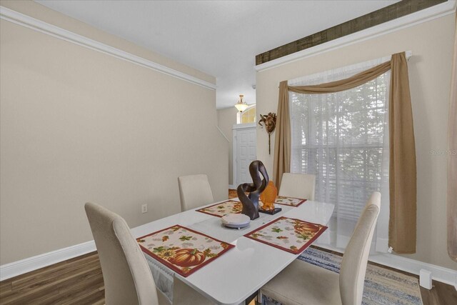 dining area with dark hardwood / wood-style flooring