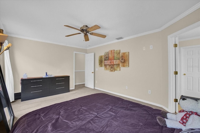 carpeted bedroom with ceiling fan and ornamental molding